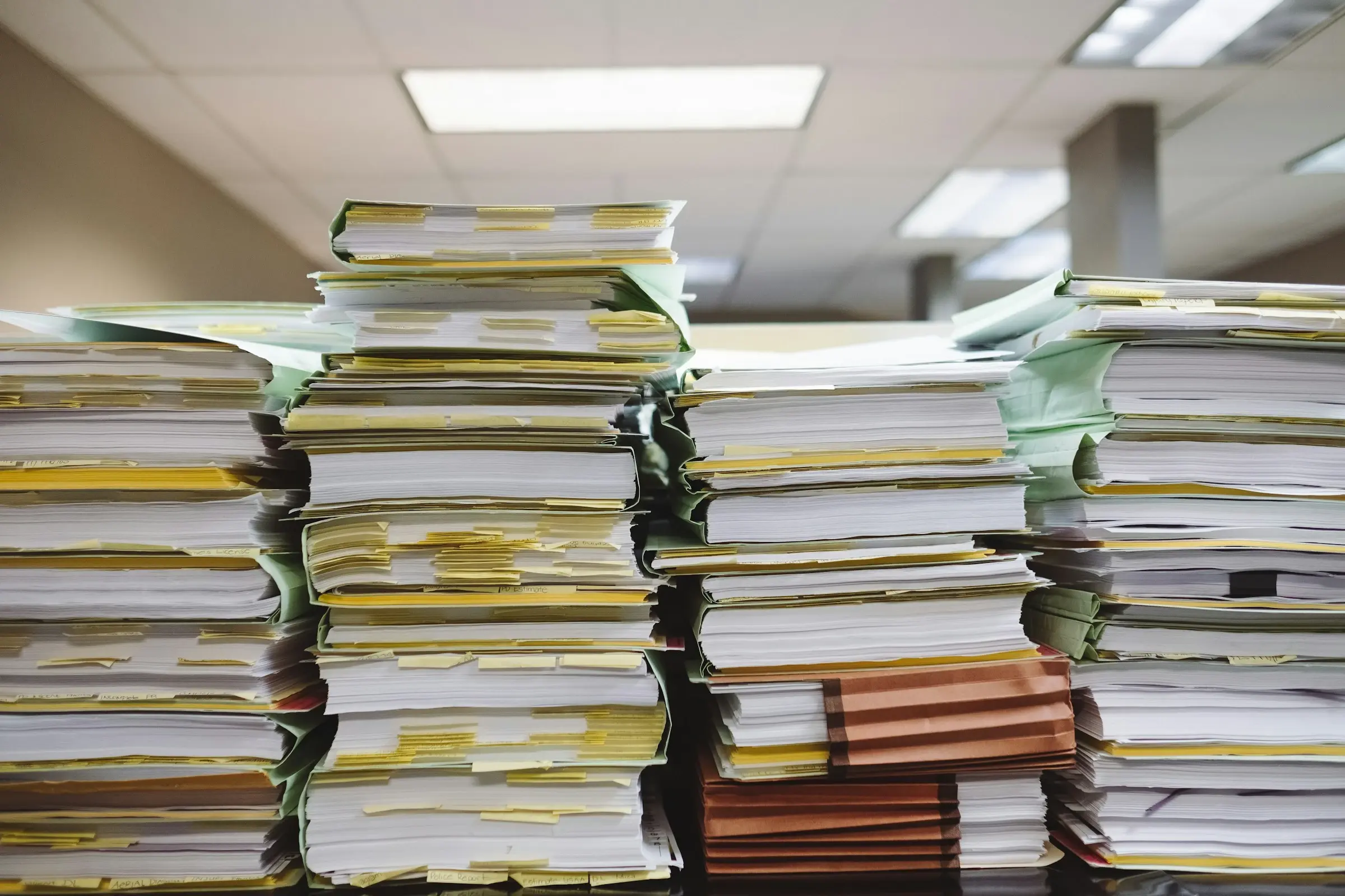 Tabbed customer files arranged inside a physical filing cabinet.